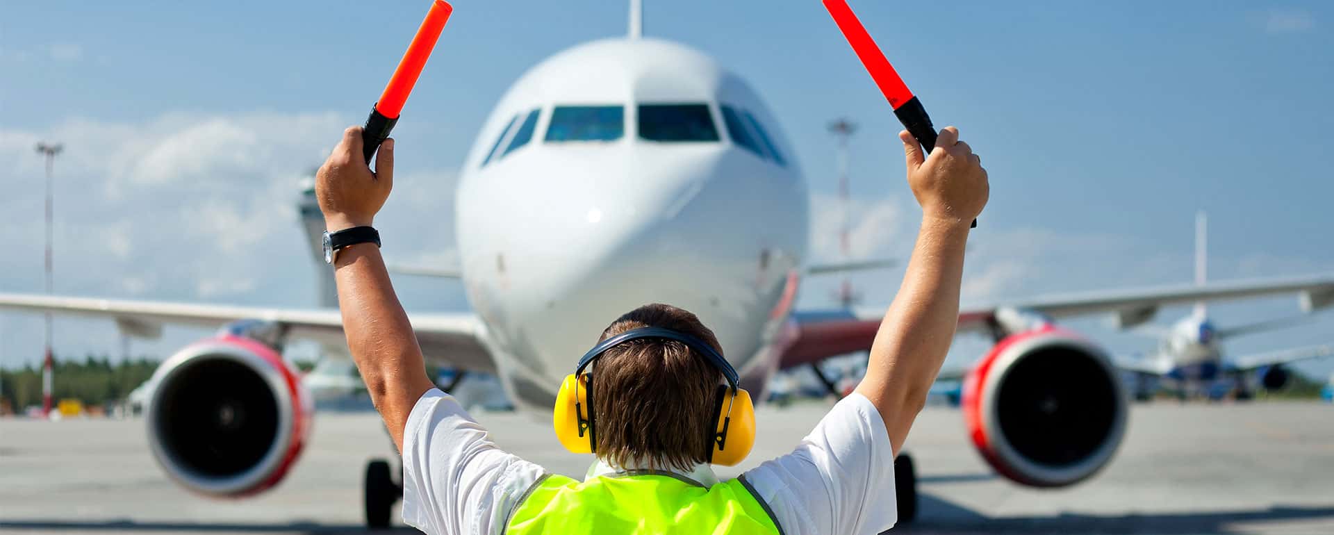 Ground Handling Agent Directing Plane